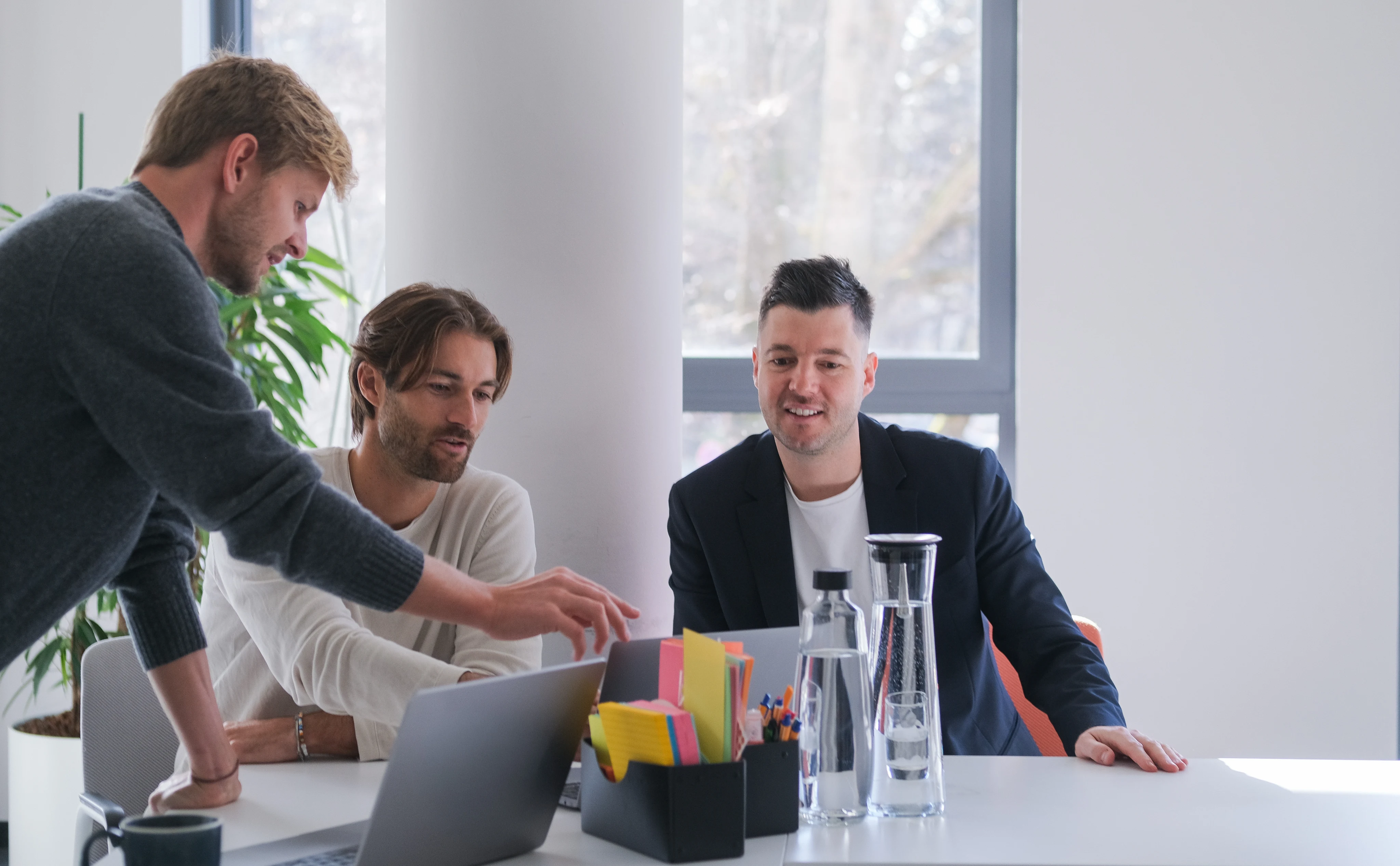 Declarium team collaborating around a table